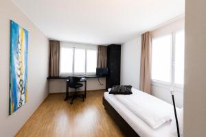 Ένα ή περισσότερα κρεβάτια σε δωμάτιο στο Hotel Bauernhof - Self Check-In Hotel