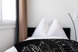 Ένα ή περισσότερα κρεβάτια σε δωμάτιο στο Hotel Bauernhof - Self Check-In Hotel