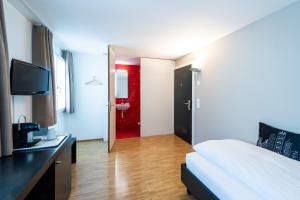 Ένα ή περισσότερα κρεβάτια σε δωμάτιο στο Hotel Bauernhof - Self Check-In Hotel