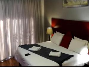 Llit o llits en una habitació de Kubo Bed and Breakfast