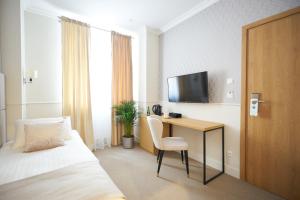 Posteľ alebo postele v izbe v ubytovaní Apartamenty Klasztorna 25