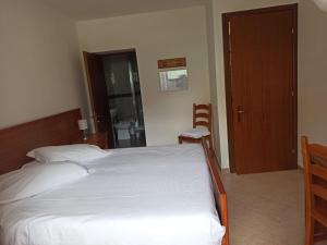 Postel nebo postele na pokoji v ubytování Albergo Miravalle