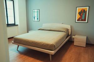 a bed in a room with a wooden floor at Az. Agr. Tenuta La Casetta in Mama