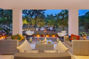 a patio with couches and a table with candles at Hotel Alpha in Sant'Agnello