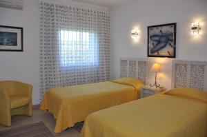 Luxury 3 bedroom Villa with Private Pool tesisinde bir odada yatak veya yataklar