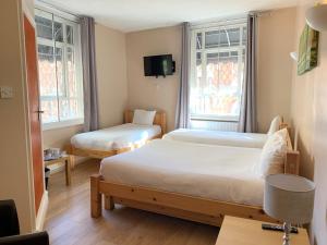 Postel nebo postele na pokoji v ubytování New Union ADULTS ONLY