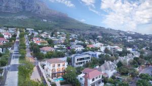 a small town in front of a mountain at De Tafelberg Guesthouse in Cape Town