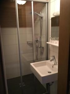 a bathroom with a shower and a sink at Haus Praxmarer in Kaunertal