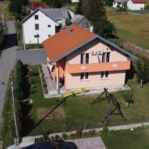 an aerial view of a house with a roof at Guest House Mačić in Korenica