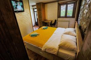 Postel nebo postele na pokoji v ubytování Apartments Tango