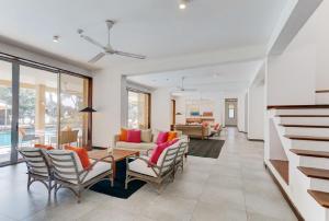 a living room with a table and chairs at Sangria Sun in Wadduwa