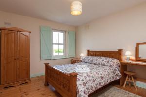 Ένα ή περισσότερα κρεβάτια σε δωμάτιο στο Kilmore Cottages Self - Catering