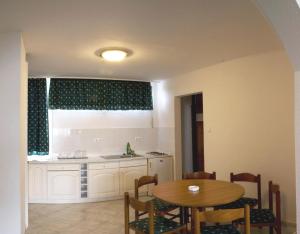 A kitchen or kitchenette at Riviera Park Hotel