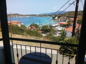 a balcony with a view of a body of water at Dasea Houses in Ormos Panagias