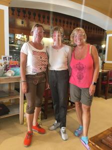 three women standing next to each other in a store at Pension Casa Austria in Calella