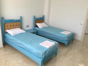Arabesque Style - 2 appartements tesisinde bir odada yatak veya yataklar