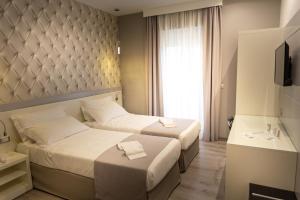 A bed or beds in a room at HOLYGOLD Suite ****