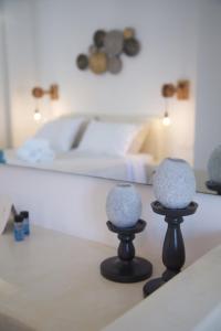 two vases sitting on a counter in a room at Diasino Apartments and Car Rental in Katapola