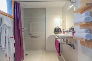 a bathroom with a shower and a sink at LA PETITE PRESQU'ILE in Locoal-Mendon +30 photos