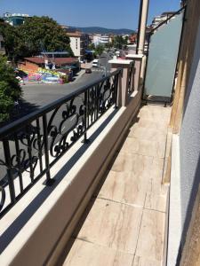 a balcony with a view of a city at Vase Apartments in Ravda