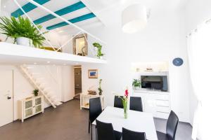 a kitchen and dining room with a table and chairs at Tony's Place in Dubrovnik