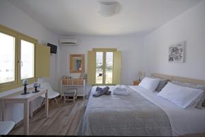 Llit o llits en una habitació de Diasino Apartments and Car Rental