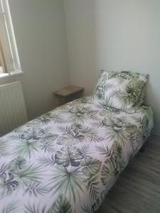 Ένα ή περισσότερα κρεβάτια σε δωμάτιο στο Le lavoir