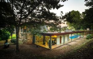 a house with a pool in front of it at Braga House & Wine in Braga