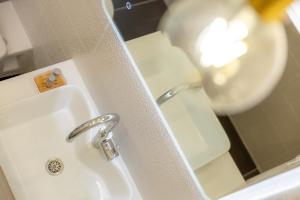 a bathroom with a sink and a shower at Les appartements chics du Vieux-Port in Marseille