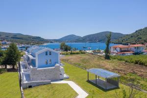 a house on a hill with a gazebo at Notia Luxury Living in Porto Koufo