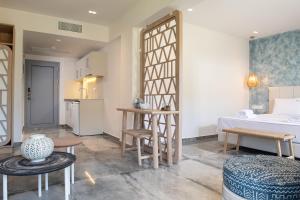 a room with a kitchen and a living room at Notia Luxury Living in Porto Koufo