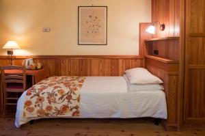מיטה או מיטות בחדר ב-Hotel Castor