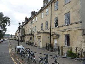 a group of bikes parked in front of a building at Central Georgian Garden Flat with Free Parking in Bath