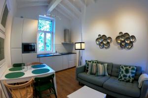 a living room with a couch and a table at Finca La Casería APARTAMENTOS in Cangas de Onís