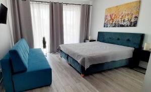 Łóżko lub łóżka w pokoju w obiekcie Flamingo Apartments