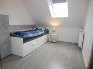Postel nebo postele na pokoji v ubytování Ferienhaus Middenin