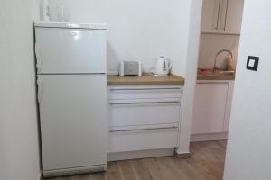Kjøkken eller kjøkkenkrok på Lumbrela Apartments