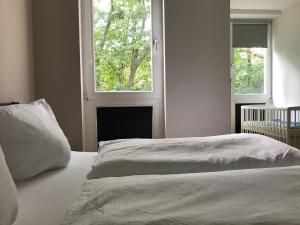 Postel nebo postele na pokoji v ubytování Neue FEWO Juventia (87 m²) - Neuseenland ganz nah!