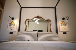 מיטה או מיטות בחדר ב-AWA Cefalù Umberto I
