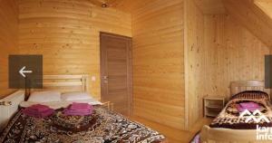 Ein Bett oder Betten in einem Zimmer der Unterkunft Садиба Надія
