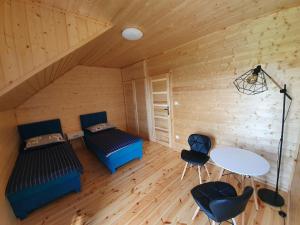 En eller flere senge i et værelse på Domki Baltic Sea