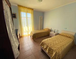 Postel nebo postele na pokoji v ubytování R&B Del Monte