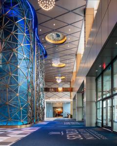 an empty lobby of a building with chandeliers at Seneca Niagara Resort & Casino in Niagara Falls