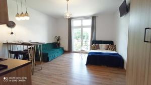 Кровать или кровати в номере Wieliczka City Apartments
