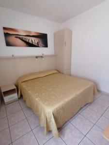 Postel nebo postele na pokoji v ubytování Camere la torre