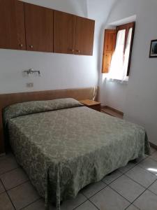 Postel nebo postele na pokoji v ubytování Camere la torre
