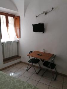 TV a/nebo společenská místnost v ubytování Camere la torre