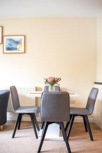 a dining room with a table and chairs at No18 Nursery Convent in Mansfield