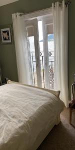 a bedroom with a bed and a view of the ocean at Conlyn house in Newcastle