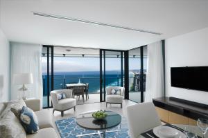 a living room with a view of the ocean at Peppers Soul Surfers Paradise in Gold Coast